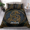Viking quilt blanket styled on a bright bedroom bed with detailed Nordic dragon artwork