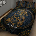 Close-up Viking bedding with intricate gold knotwork, Norse dragon artwork, and deep blue details