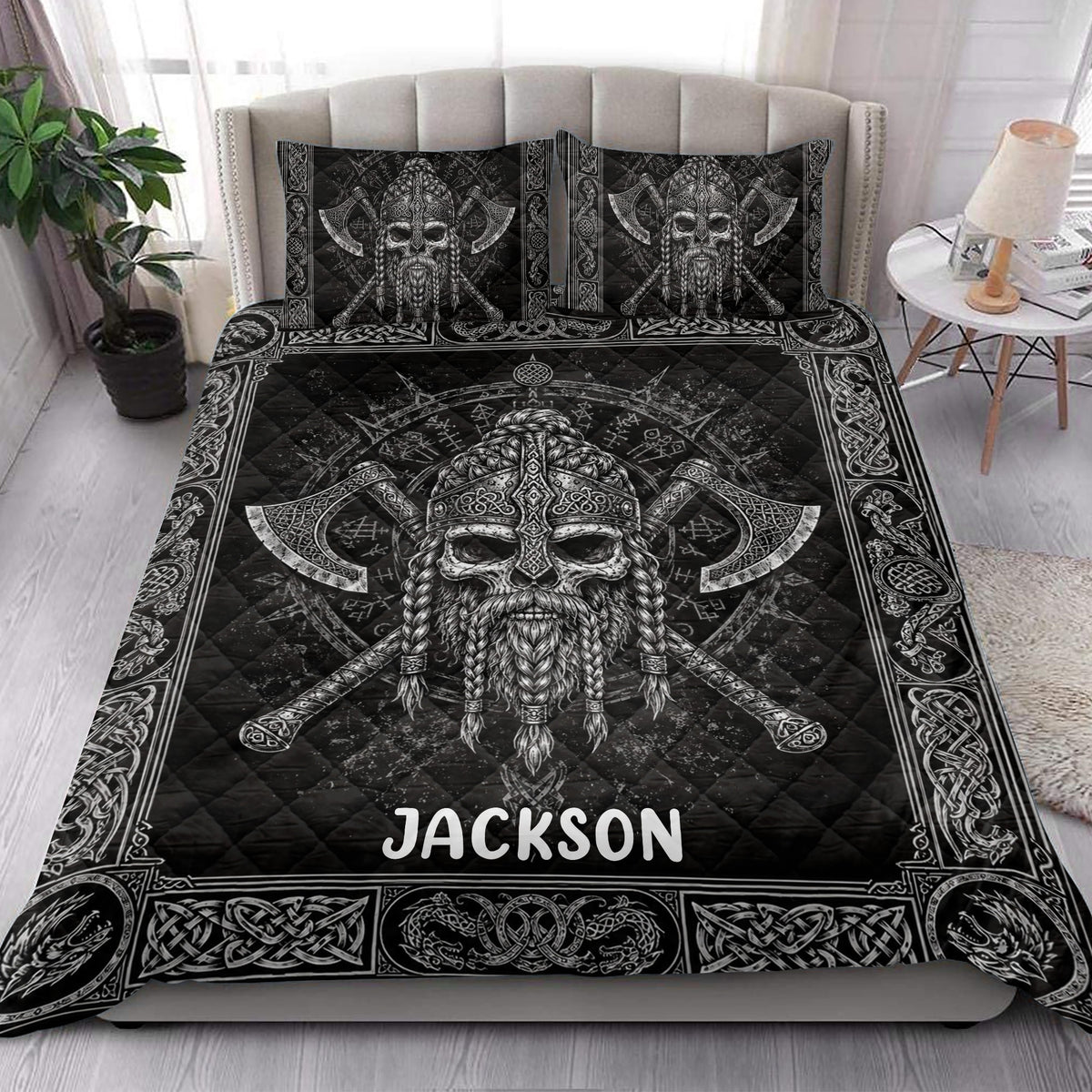 Viking quilt blanket bedding styled on a bedroom bed with black and white Nordic artwork
