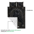 Viking quilt blanket detail showing a printed raven design, white quilted backing and Norse-inspired borders