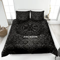 Black Viking quilt blanket displayed on a bed with Norse compass symbols, runes, dragons, and knotwork artwork