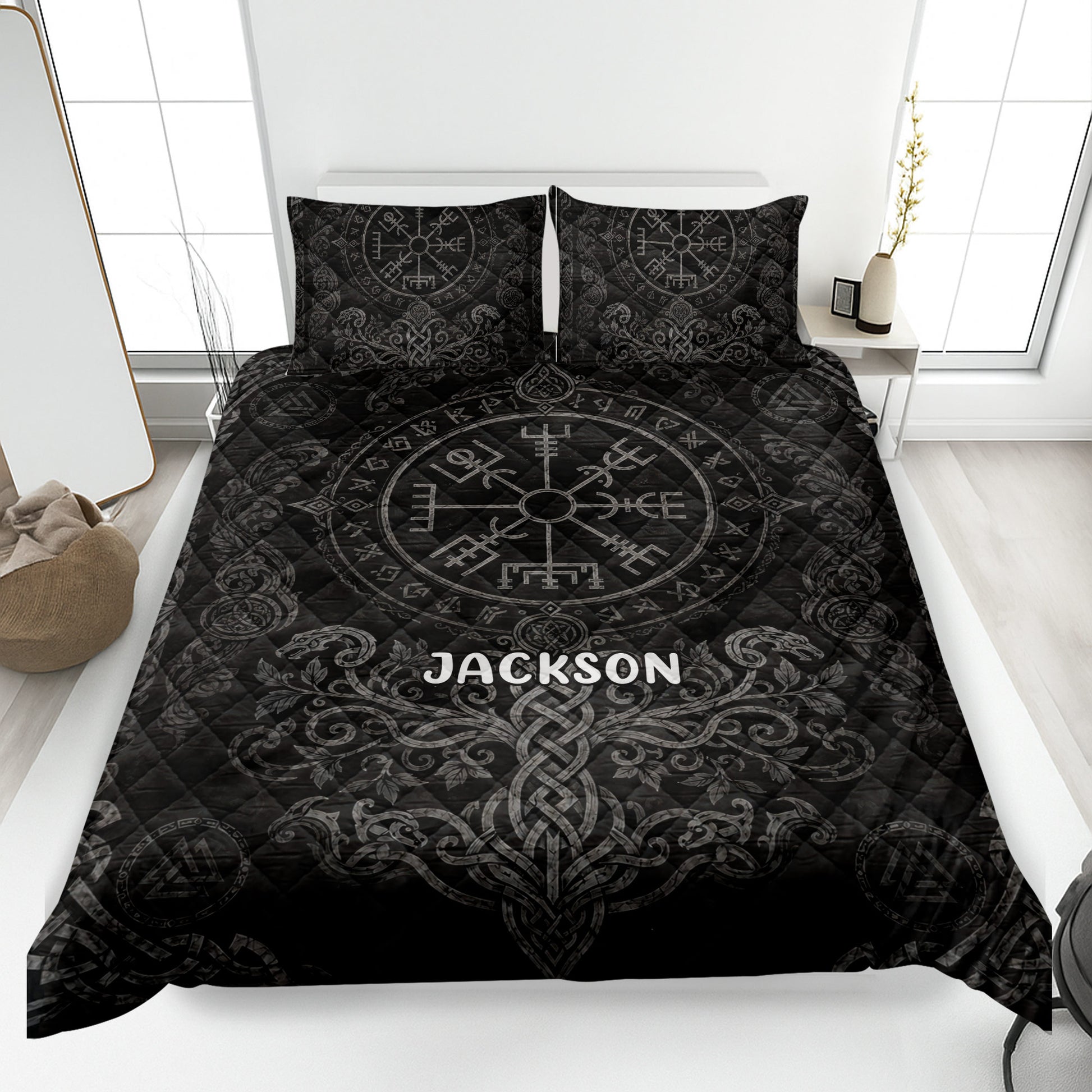 Black Viking quilt blanket displayed on a bed with Norse compass symbols, runes, dragons, and knotwork artwork