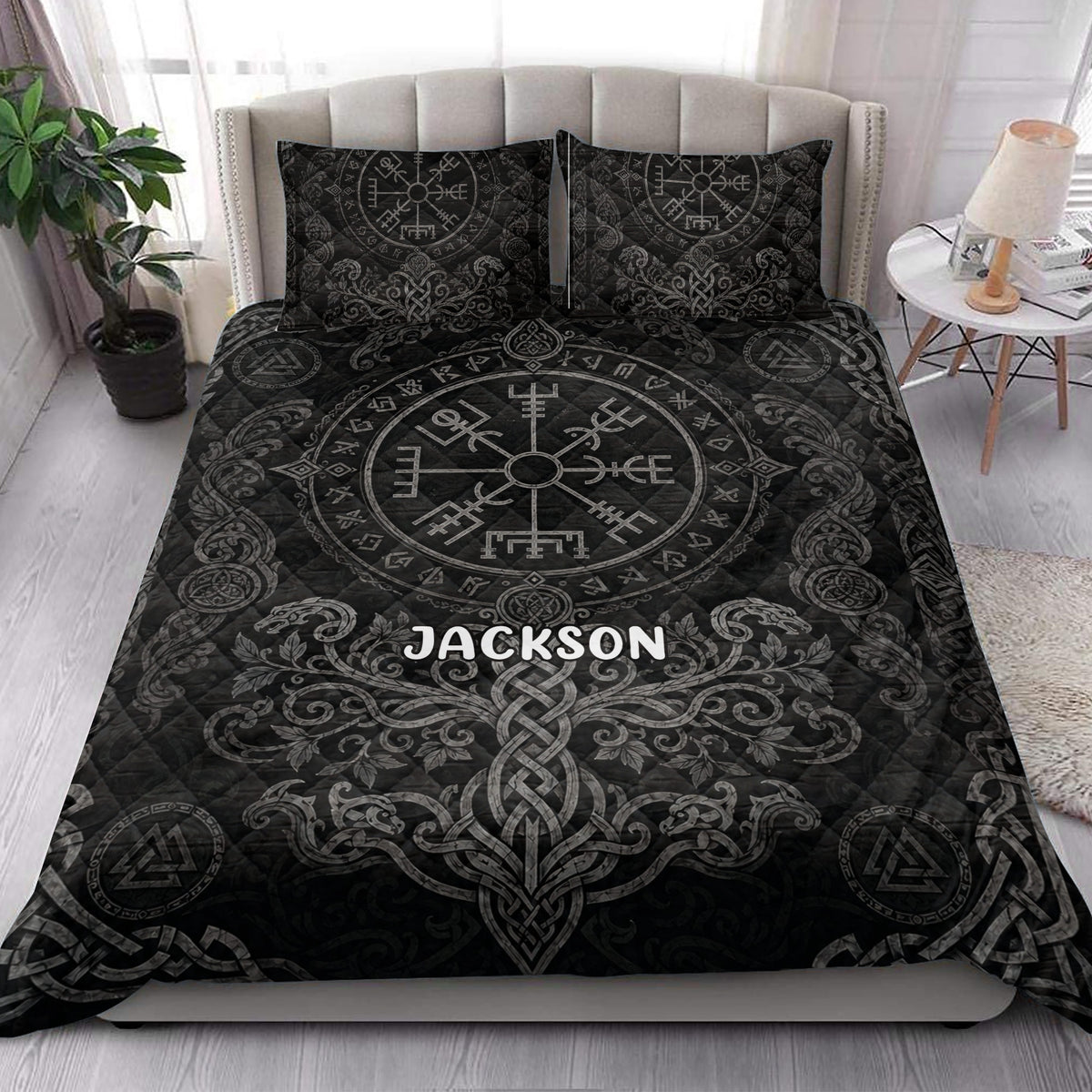Black Viking quilt bedding set styled in a bright bedroom with Norse symbols, dragons, and intricate gray knotwork