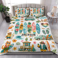 Surfing quilt blanket styled in a bright bedroom with colorful surfboards, ocean waves, palms, and beach scenes