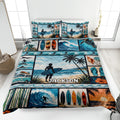 Surfing quilt bedding set displayed on a bed with surfers, surfboards, ocean waves, palms and coastal artwork