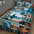 Close bedroom view of a colorful surfing quilt with waves, surfboards, palms, shells and coastal scenes