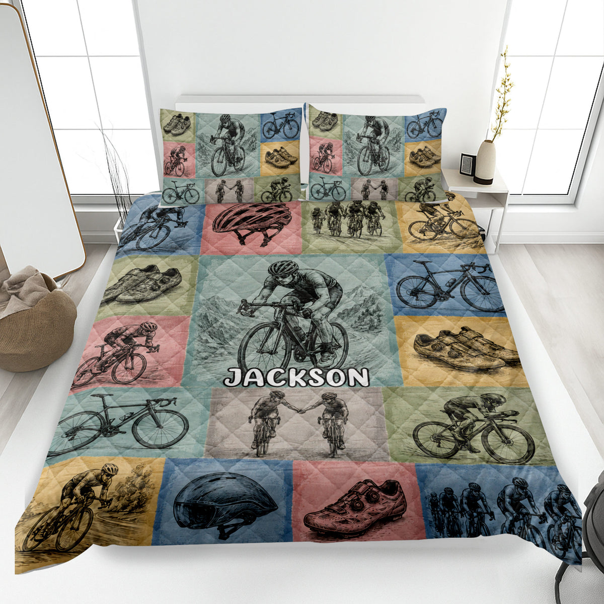 Custom bicycle quilt blanket displayed on a bed with colorful cycling scenes, bikes, helmets, and riders