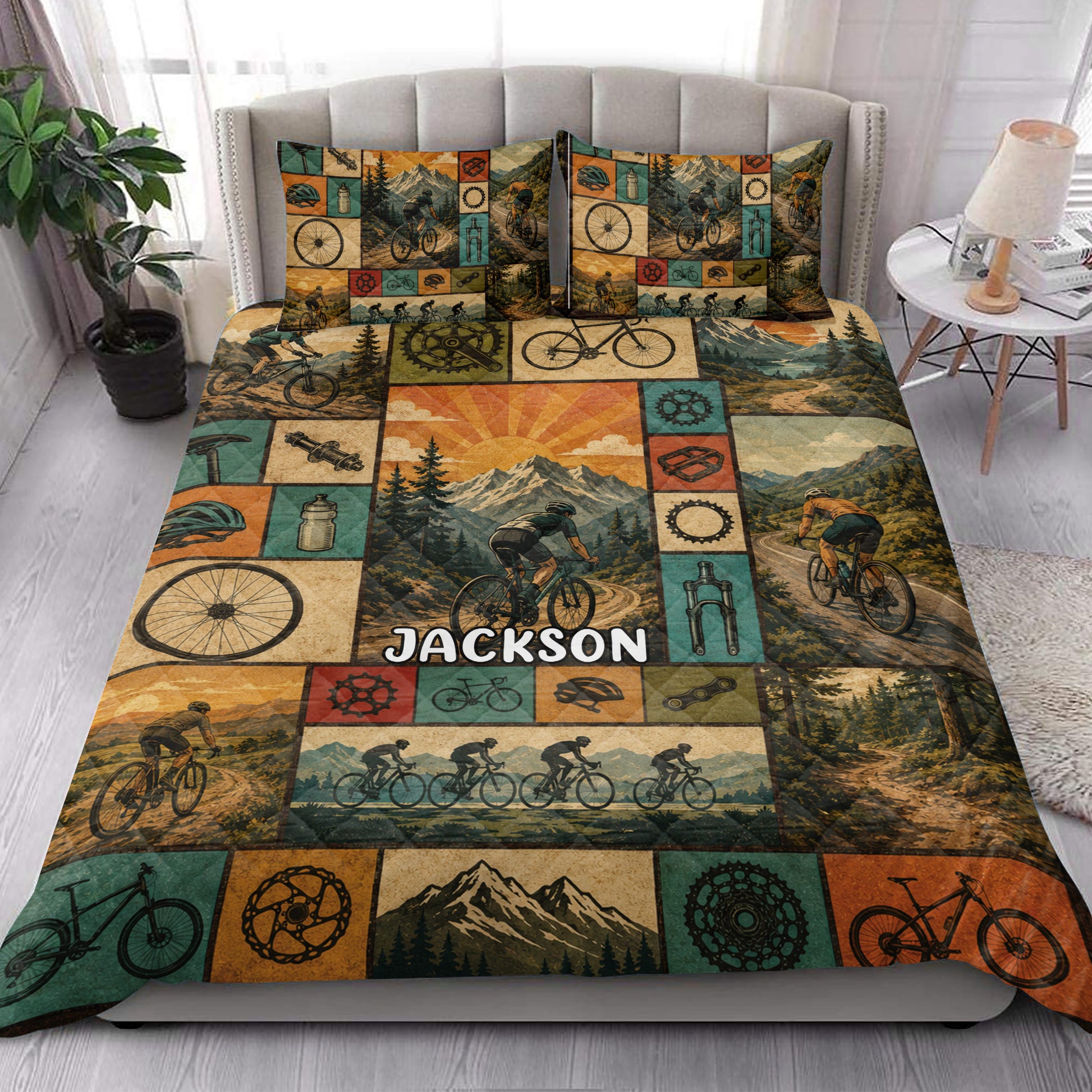 Bicycle quilt blanket styled in a bright bedroom with cyclists, bicycles, gears, and mountain scenery
