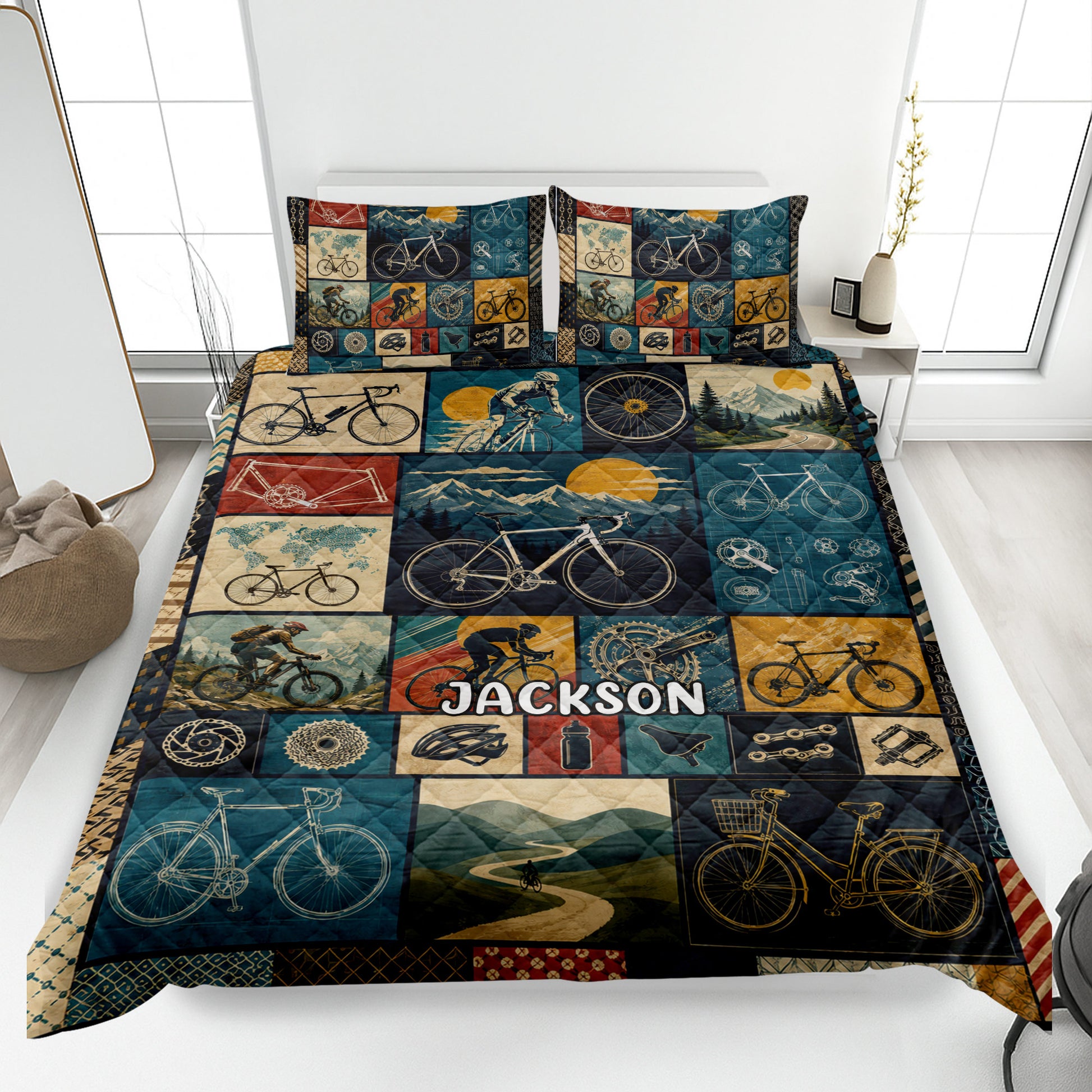 Bicycle quilt blanket displayed on a bed with vintage cycling, mountain, road, and bicycle collage artwork