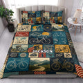 Bicycle quilt blanket styled in a bright bedroom with vintage bicycles, cyclists, mountains, and road scenes