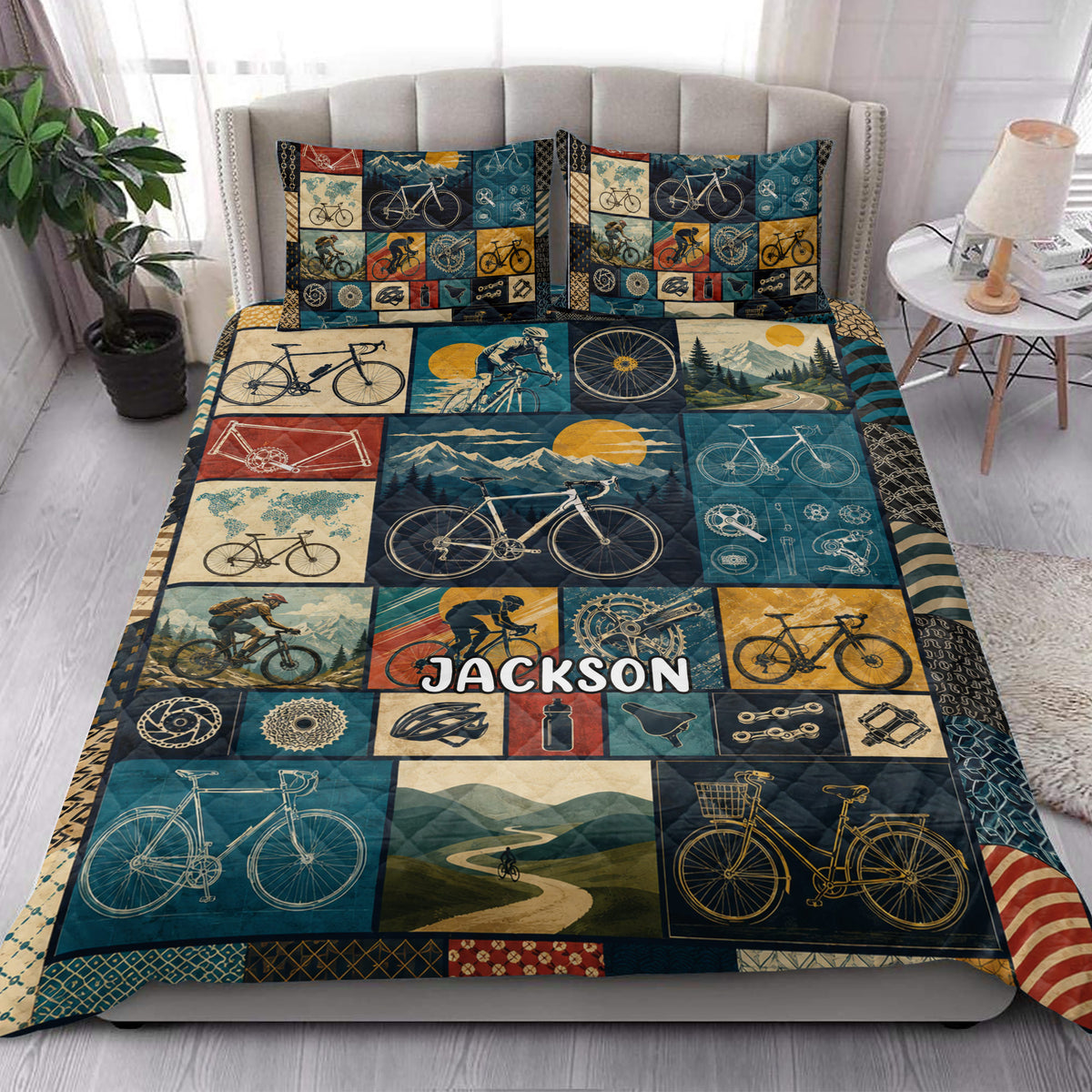 Bicycle quilt blanket styled in a bright bedroom with vintage bicycles, cyclists, mountains, and road scenes