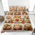 Hamster quilt blanket spread across a bed with strawberry, flower, basket, and teacup artwork