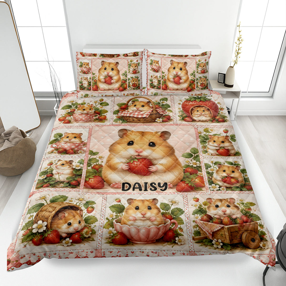 Hamster quilt blanket spread across a bed with strawberry, flower, basket, and teacup artwork