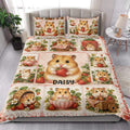 Hamster and strawberry quilt blanket styled in a bright bedroom with coordinating pillow artwork