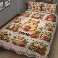 Close bedroom view of a hamster quilt blanket featuring strawberries, flowers, baskets, and teacups