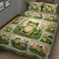 Close bedroom view of a frog quilt blanket with pond flowers and playful green frog artwork