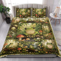 Frog quilt blanket styled on a bright bedroom bed with forest, mushroom, and wildflower artwork