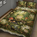 Close view of frog quilt bedding with detailed woodland scenes, mushrooms, flowers, and multiple frogs