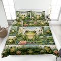Frog quilt blanket bedding set displayed on a bed with colorful pond scenes, lily pads, lotus flowers, and dragonflies