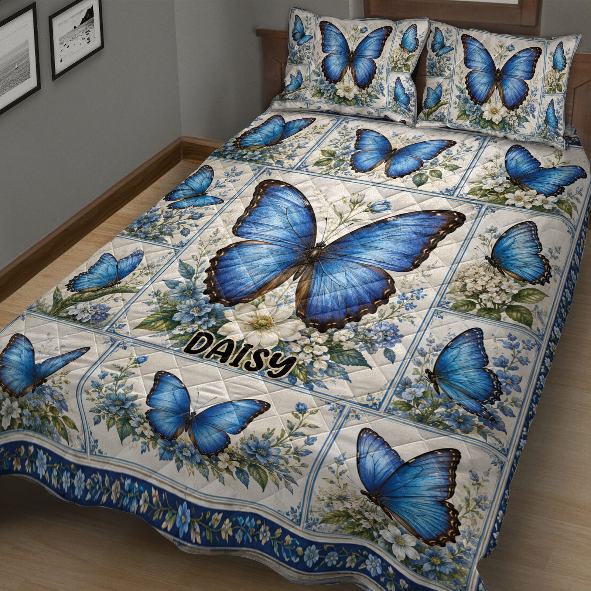 Close bedroom view of a blue butterfly quilt blanket with botanical floral artwork