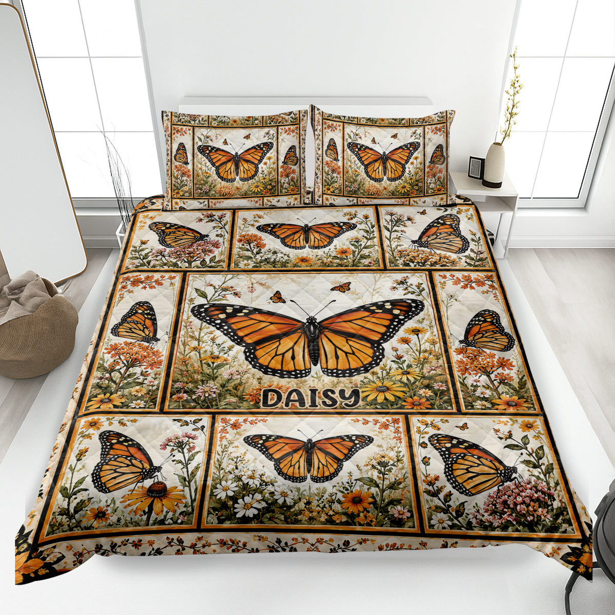 Butterfly quilt bedding set displayed on a bed with orange monarch butterflies and wildflower panels