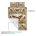 Butterfly quilt bedding set showing the printed floral side and white quilted backing