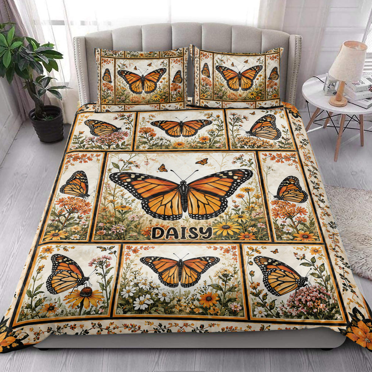 Butterfly quilt blanket styled in a bright bedroom with orange butterflies and garden flowers