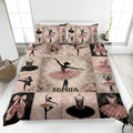 Ballet quilt blanket bedding set displayed on a bed with pink tutus, pointe shoes, roses, and dancer silhouettes