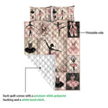 Ballet quilt blanket detail showing printed ballerina panels, pointe shoes, floral accents, and white quilt backing