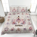Ballet quilt blanket bedding set displayed on a bed with ballerinas, pointe shoes, flowers, and soft pink artwork