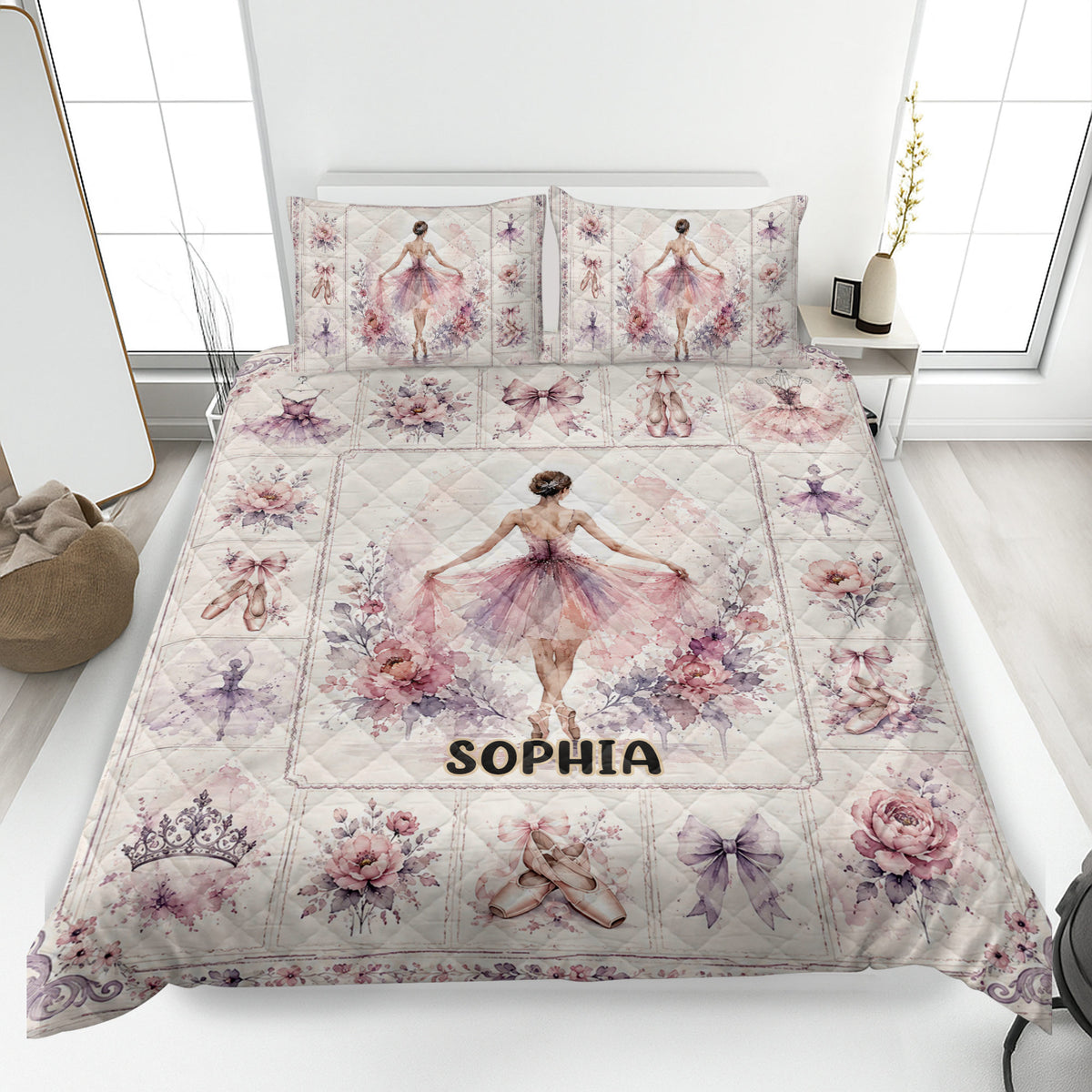 Ballet quilt blanket bedding set displayed on a bed with ballerinas, pointe shoes, flowers, and soft pink artwork