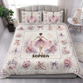 Ballet quilt blanket styled in a bedroom with ballerina illustrations, floral panels, bows, and pointe shoes