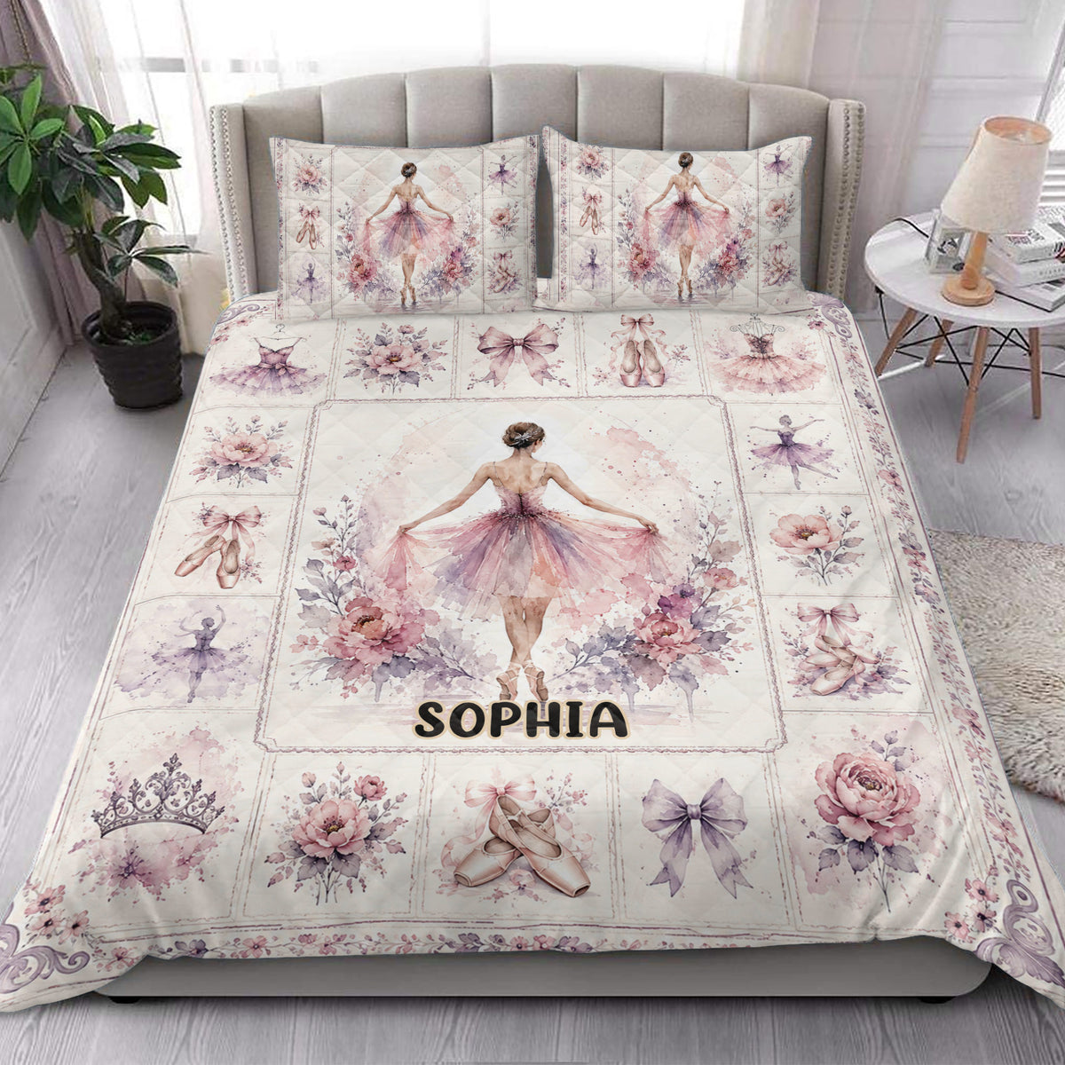 Ballet quilt blanket styled in a bedroom with ballerina illustrations, floral panels, bows, and pointe shoes