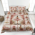 Ballet quilt blanket displayed on a bed with pink tutus, pointe shoes, roses, chandeliers, and elegant ballet artwork