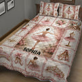 Ballet quilt blanket presented on a bed with ballerina scenes, pink flowers, pointe shoes, and romantic vintage decor