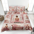 Pink ballet quilt blanket displayed on a bed with ballerinas, pointe shoes, roses, bows, and elegant vintage decor