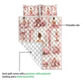 Ballet quilt blanket detail showing printed ballerinas, pointe shoes, pink roses, and a white quilted backing