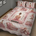 Pink ballerina quilt blanket styled on a bed with pointe shoes, floral artwork, roses, bows, and elegant ballet decor
