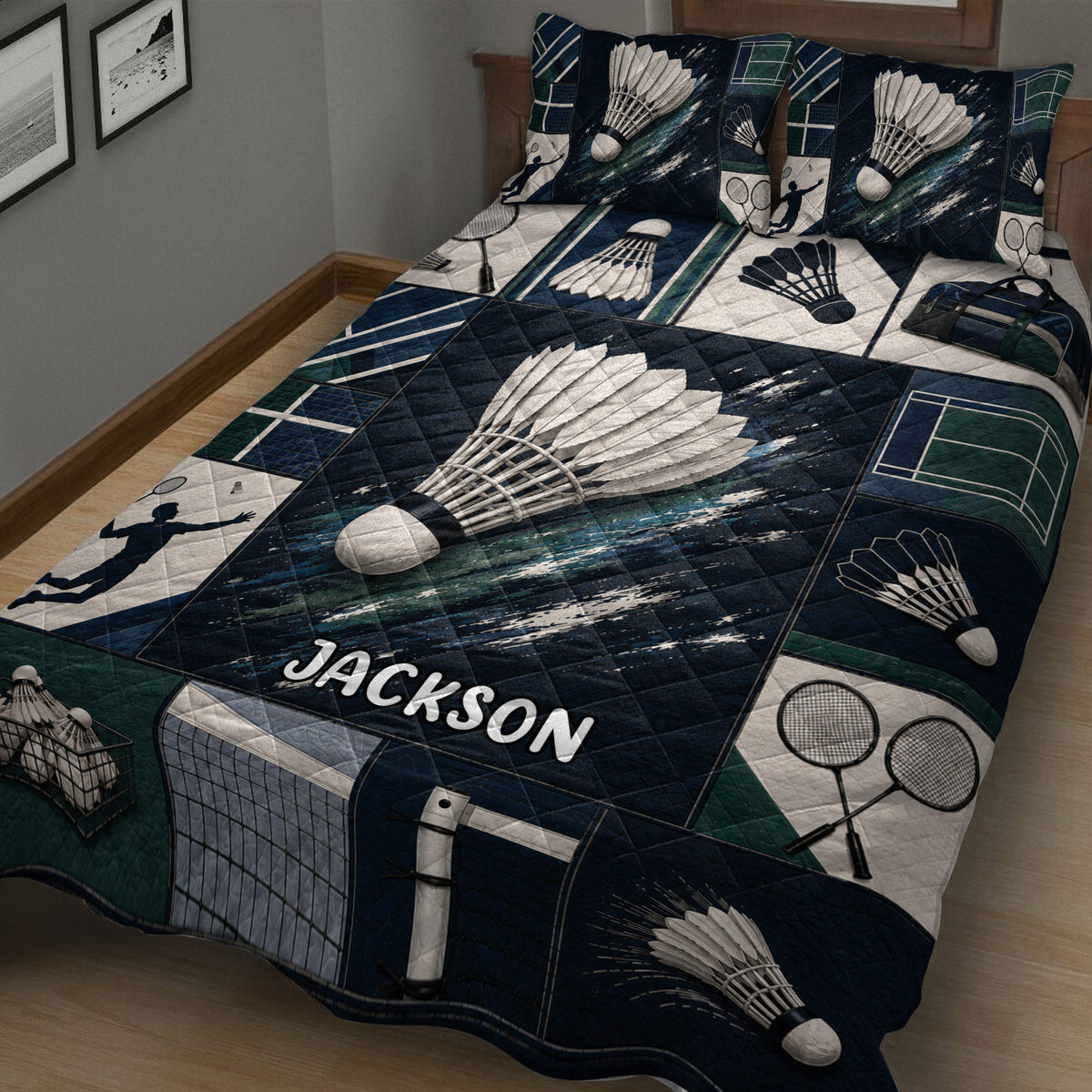Badminton bedding quilt shown across a bed with bold navy artwork, shuttlecocks, rackets, and player silhouettes