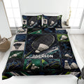 Badminton quilt blanket displayed on a bed with rackets, shuttlecocks, sports gear, and dark blue green artwork