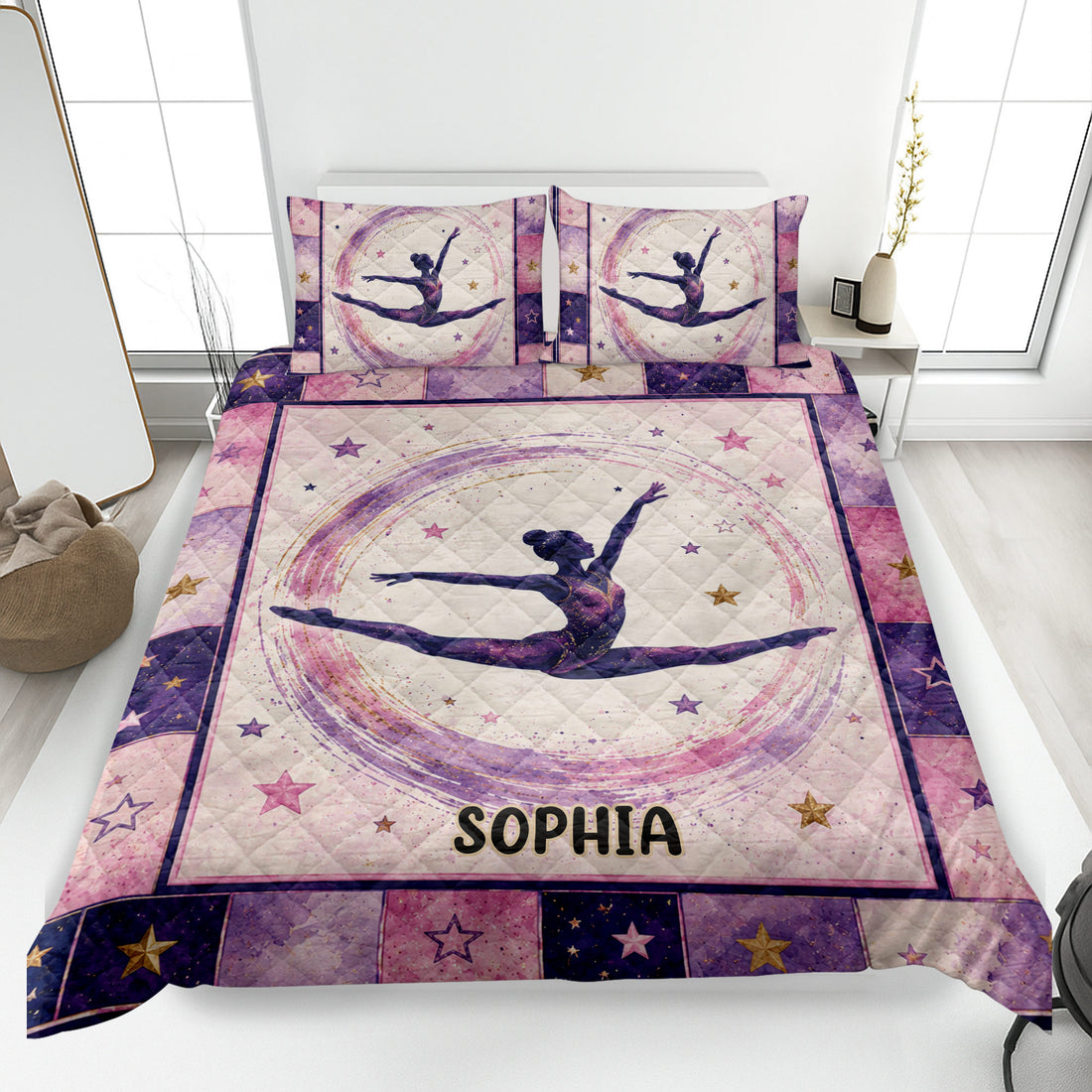 Gymnastics quilt blanket displayed on a bed with a female gymnast, stars, and pink and purple artwork