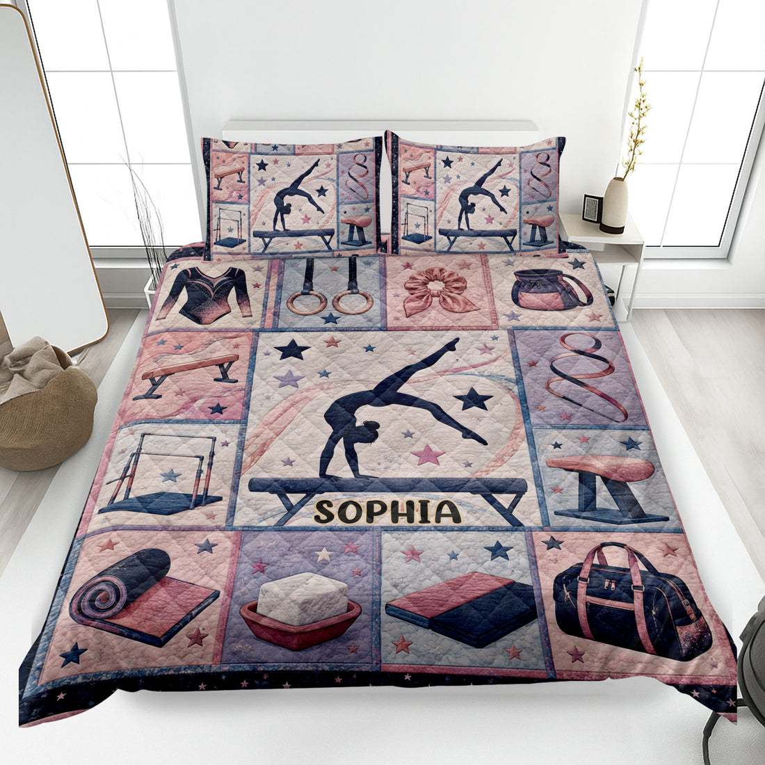 Gymnastics quilt blanket displayed on a bed with gymnast artwork, stars and gymnastics apparatus