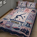 Close-up bedroom view of a gymnastics quilt blanket with gymnast, beam and rings artwork
