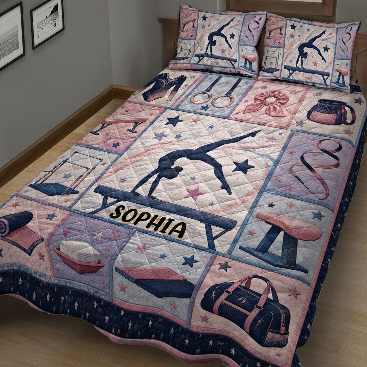Close-up bedroom view of a gymnastics quilt blanket with gymnast, beam and rings artwork
