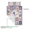 Gymnastics quilt blanket detail showing the printed floral side and quilted white backing