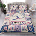 Gymnastics quilt bedding styled in a bright bedroom with colorful floral panels and gymnast artwork