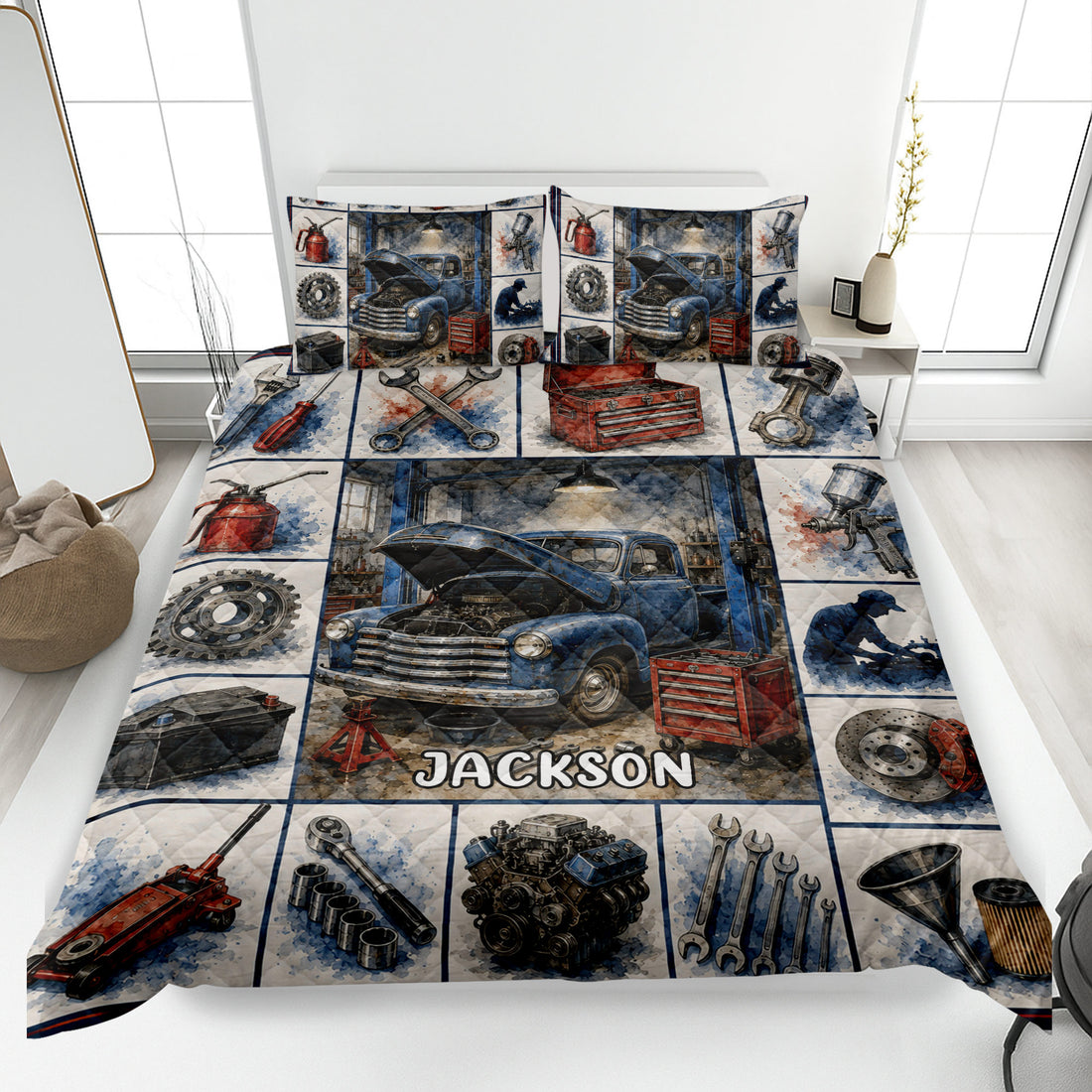 Mechanic quilt blanket displayed on a bed with vintage truck, tools, engine parts, and garage artwork