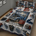 Close view of mechanic quilt bedding with vintage truck, engine parts, tools, and red-blue garage artwork