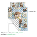 Otter quilt blanket showing the printed front artwork and quilted white backing detail