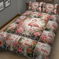 Close view of a flamingo quilt bedding set with floral panels and tropical pink bird artwork
